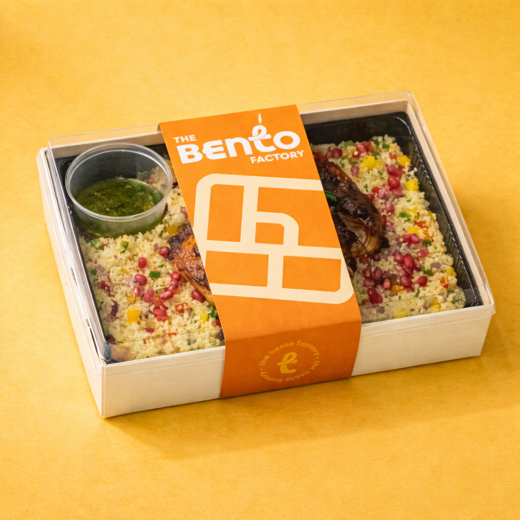 Moroccan Style Couscous with Peri Chicken in a bento box with The Bento Factory Logo Sleeve
