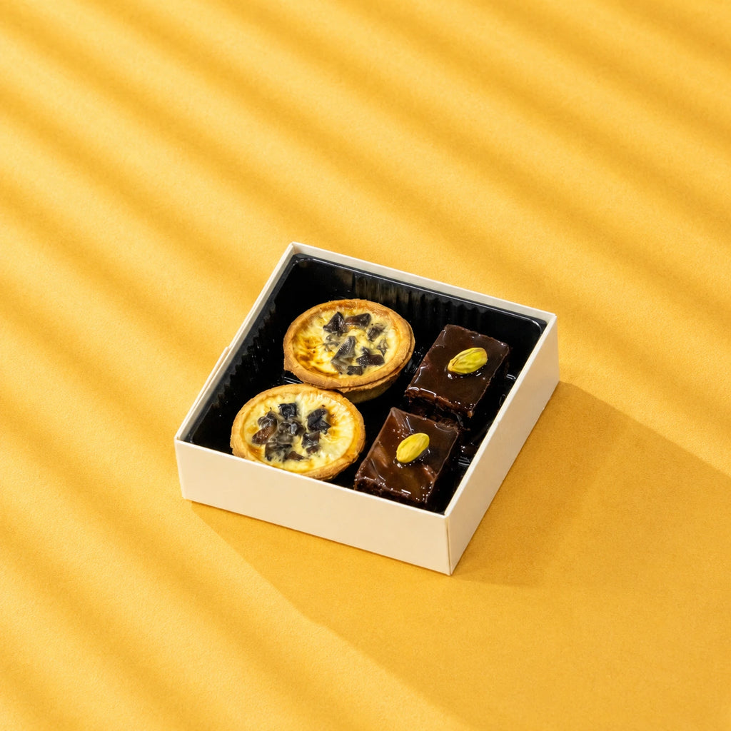 mushroom quiche and chocolate fudge cake in a square bento box